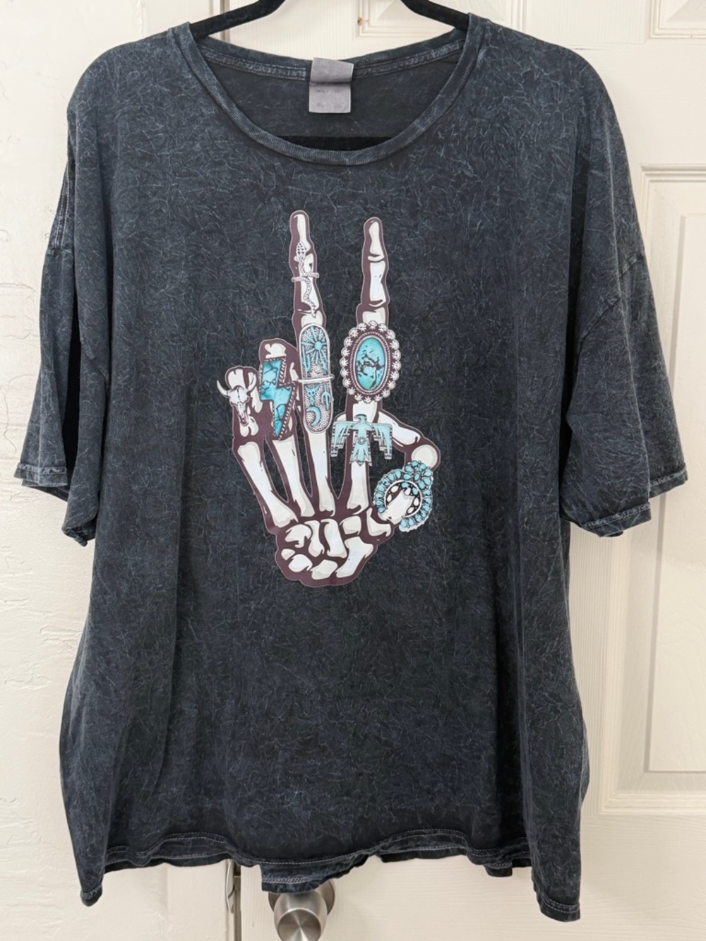 Black Mineral Wash Tee with Turquoise Skeleton Hand Graphic
